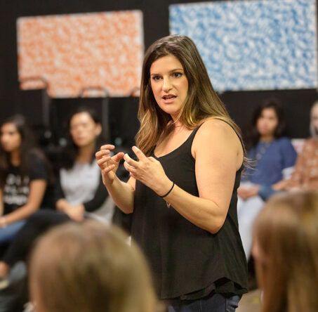 A woman teaches a class.