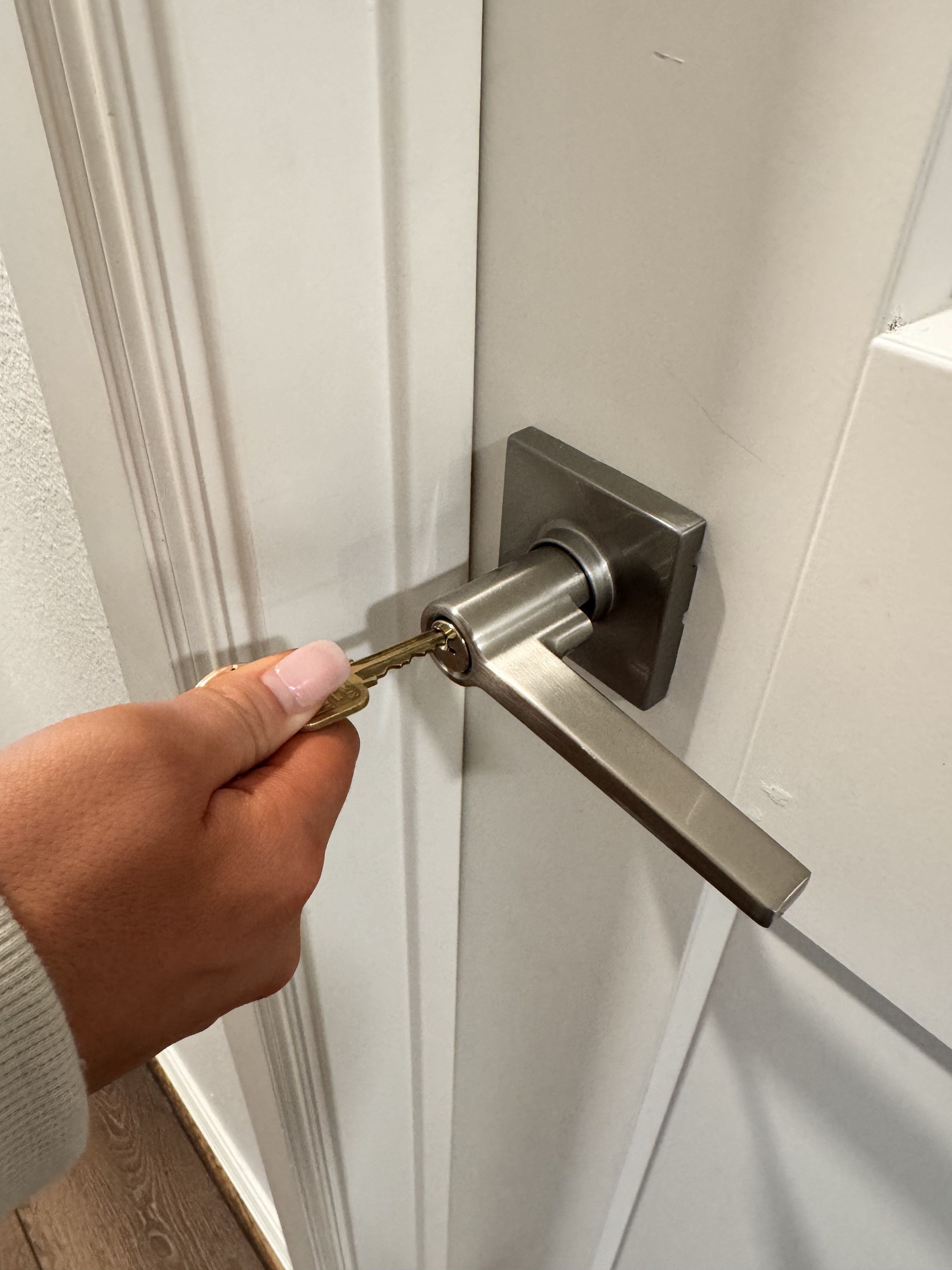 a key is attached to a wooden door